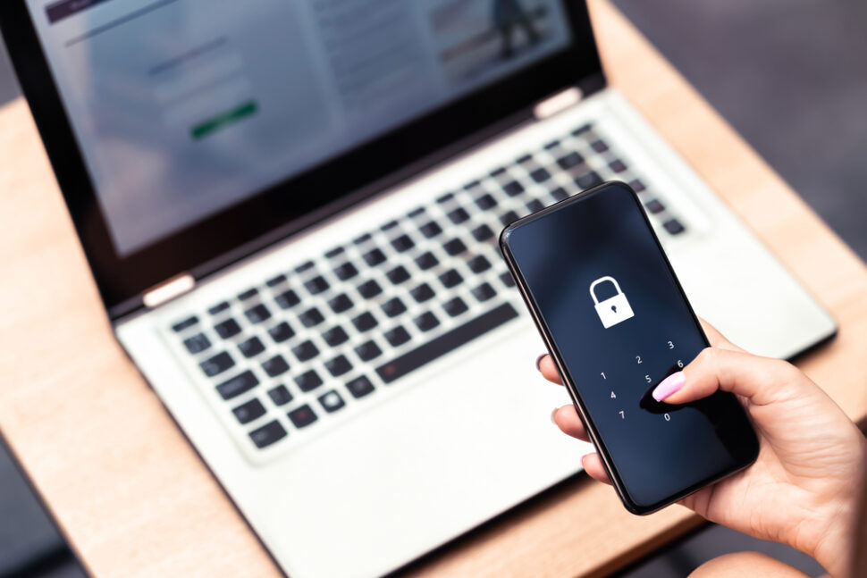 Smartphone with lock symbol and laptop, highlighting data privacy in marketing from beMarketing's insights on consumer trust.