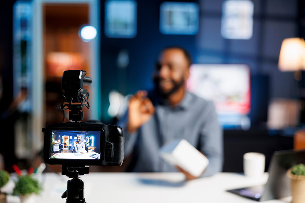 Man at desk presenting product in modern home office for influencer marketing strategies by beMarketing.